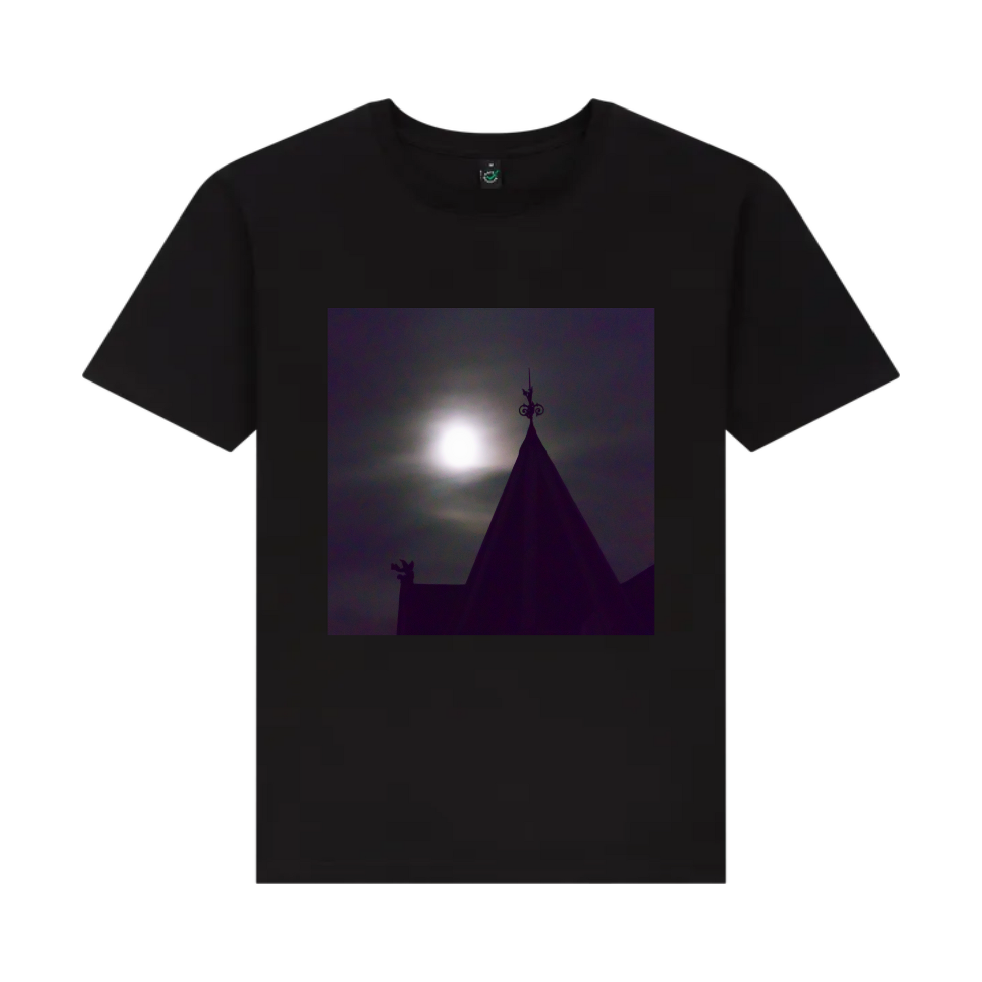 A black t-shirt featuring a front graphic print of a gothic building under a moonlit night sky.