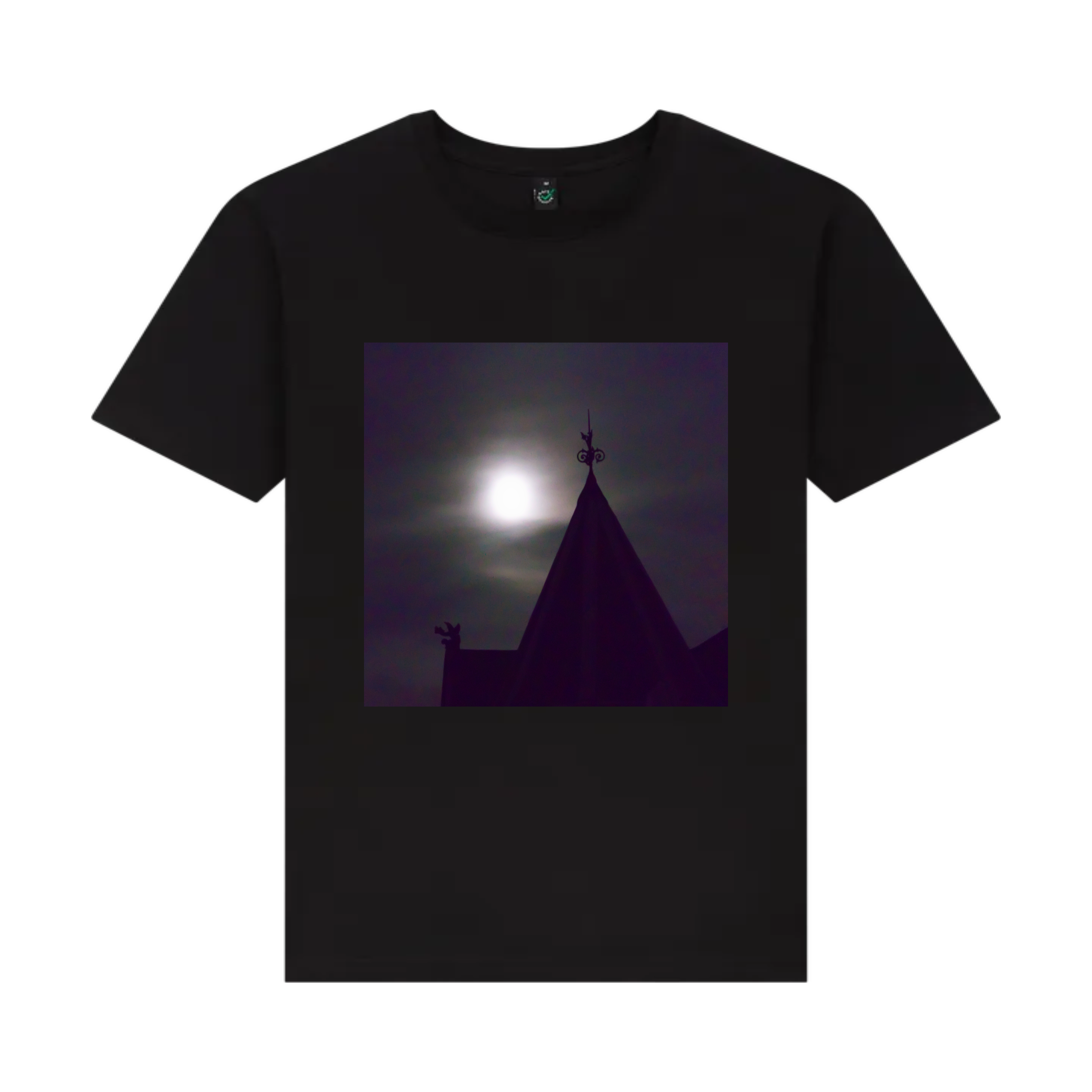 A black t-shirt featuring a front graphic print of a gothic building under a moonlit night sky.