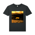 t-shirt with a graphic of a big cat walking in a field at sunset on a scorched foreign plain