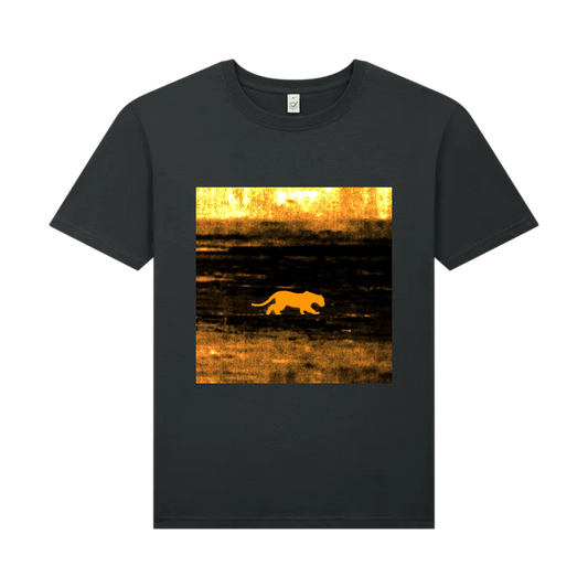t-shirt with a graphic of a big cat walking in a field at sunset on a scorched foreign plain